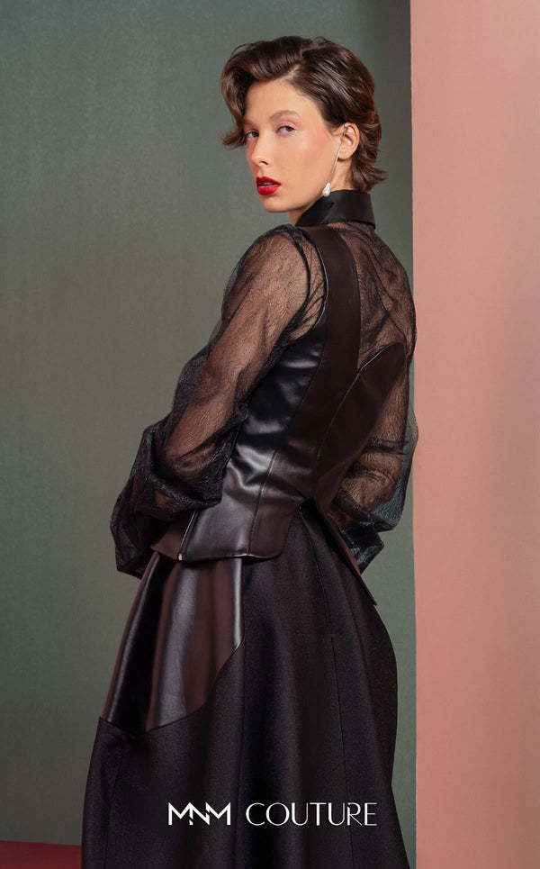 MNM Couture GOF2520 two-piece ensemble, featuring a black one-shoulder faux leather top and a matching black mikado piqué A-line skirt with leather side inserts. | Couture Shop LA