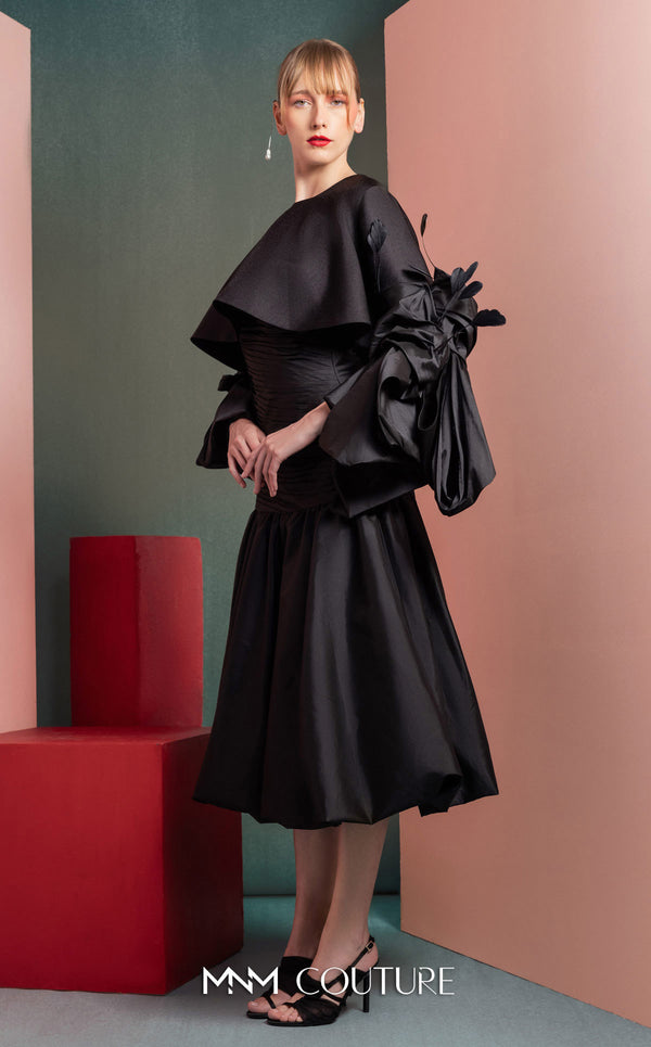 MNM Couture GOF2525 ball gown in black taffeta, featuring an elegantly draped bodice and a voluminous, floor-sweeping skirt. | Couture Shop LA