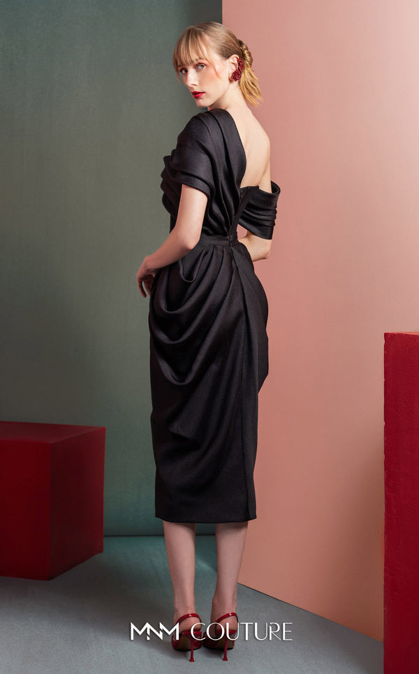 MNM Couture GOF2528 two-piece ensemble in black mikado piqué, featuring a sculpted skirt with intricate draping and a matching draped one-shoulder top. | Couture Shop LA