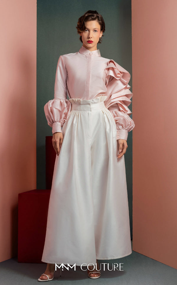 MNM Couture GOF2529 two-piece ensemble, featuring high-waisted white taffeta wide-leg pants and a tailored soft pink blouse with intricate ruffled sleeves. | Couture Shop LA