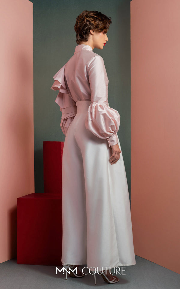 MNM Couture GOF2529 two-piece ensemble, featuring high-waisted white taffeta wide-leg pants and a tailored soft pink blouse with intricate ruffled sleeves. | Couture Shop LA