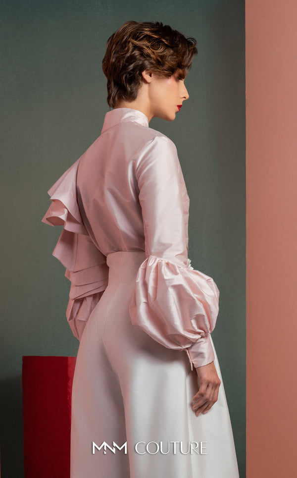 MNM Couture GOF2529 two-piece ensemble, featuring high-waisted white taffeta wide-leg pants and a tailored soft pink blouse with intricate ruffled sleeves. | Couture Shop LA