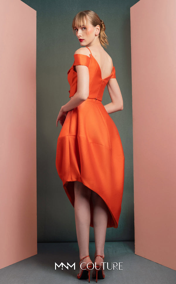 MNM Couture GOF2537 orange mikado piqué high-low skirt with elegant draping, paired with an off-the-shoulder ruffled cropped top. | Couture Shop LA