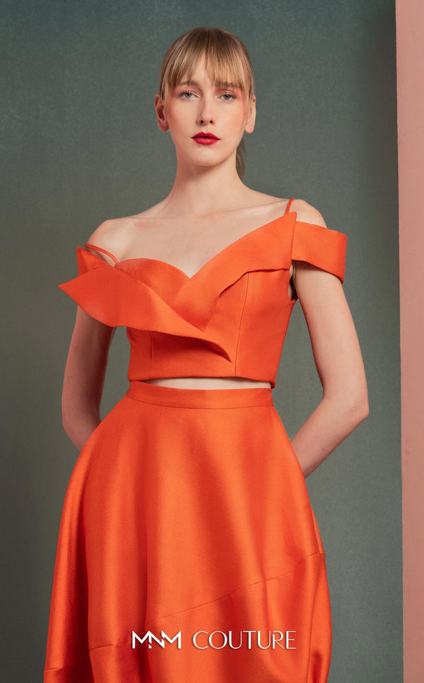MNM Couture GOF2537 orange mikado piqué high-low skirt with elegant draping, paired with an off-the-shoulder ruffled cropped top. | Couture Shop LA