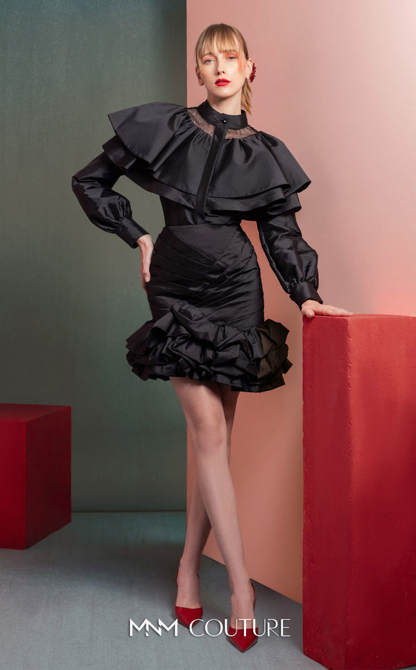 MNM Couture GOF2539 two-piece ensemble in black taffeta, featuring a dramatic ruffled blouse with sheer neckline accents and a matching ruched skirt with a ruffled hem. | Couture Shop LA