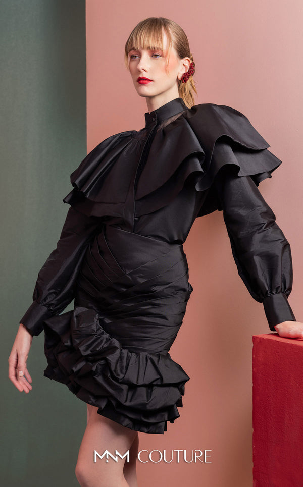 MNM Couture GOF2539 two-piece ensemble in black taffeta, featuring a dramatic ruffled blouse with sheer neckline accents and a matching ruched skirt with a ruffled hem. | Couture Shop LA