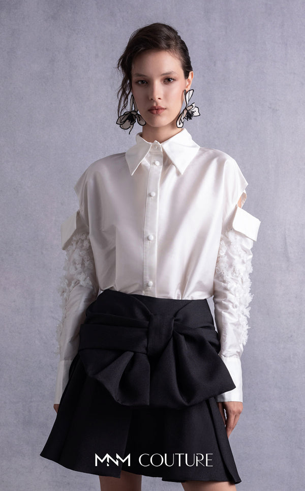 MNM Couture GOS2519 Black piqué skirt with bow design and off-white taffeta blouse with embroidered sleeves and cut-out shoulders. | Couture Shop LA