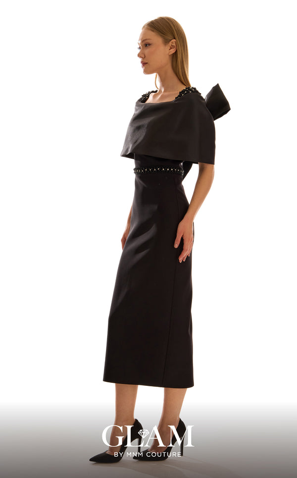 MNM Couture H09683 black satin mikado midi dress with off-shoulder capelet, crystal and pearl shoulder clusters, crystal rhinestone waistband, and oversized structured bow at center back | Couture Shop LA
