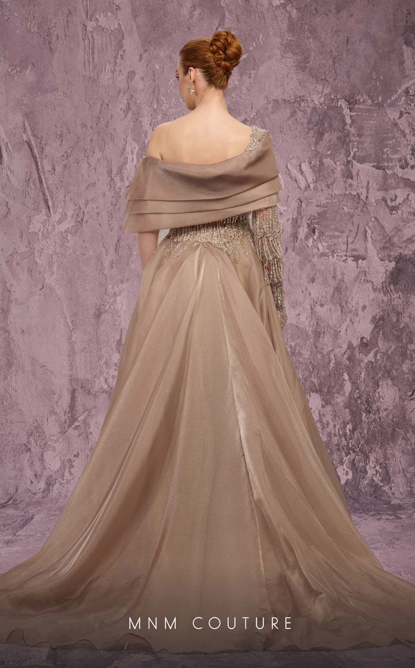 MNM Couture Style J03308 one-sleeved ballgown with beaded fringe, organza skirt, and asymmetrical neckline. \ Couture Shop LA