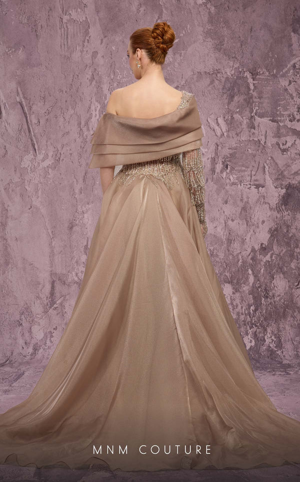 MNM Couture Style J03308 one-sleeved ballgown with beaded fringe, organza skirt, and asymmetrical neckline. \ Couture Shop LA