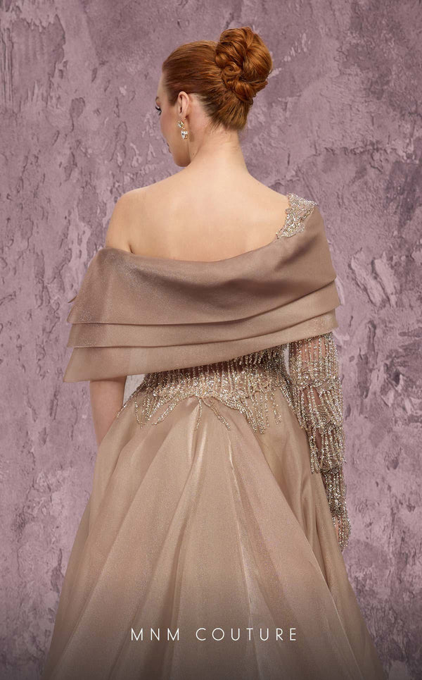 MNM Couture Style J03308 one-sleeved ballgown with beaded fringe, organza skirt, and asymmetrical neckline. \ Couture Shop LA