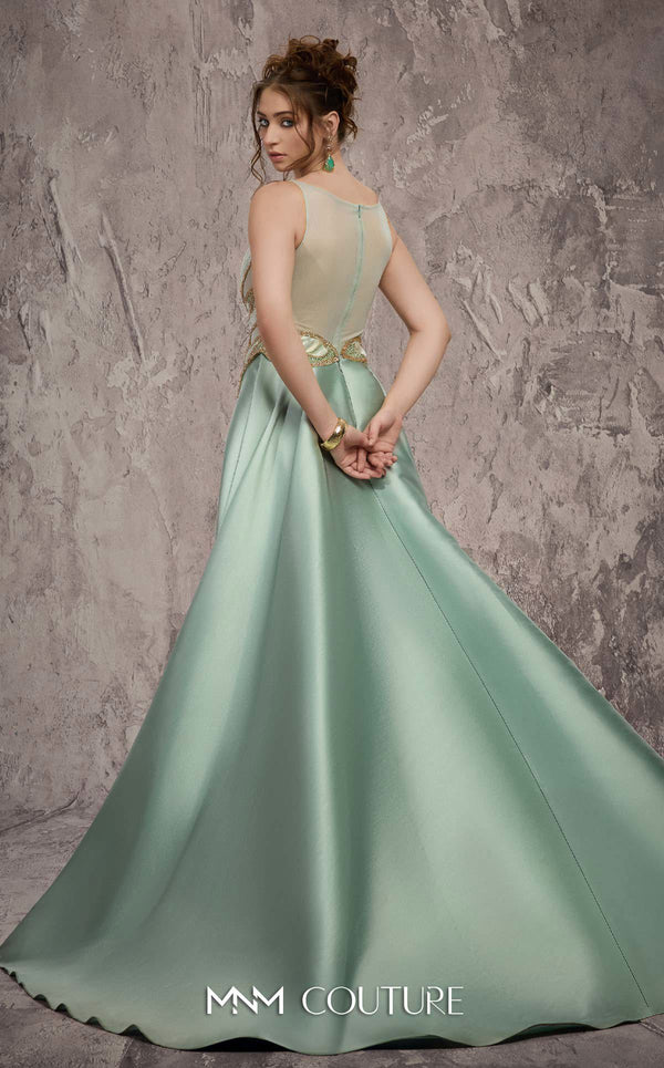 MNM Couture Style J03503 beaded column gown with a double skirt train and sheer neckline. \ Couture Shop LA