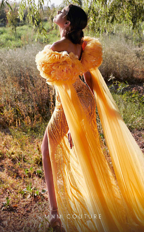 MNM Couture K3934 sheath gown with rosette embellishment, high slit, and cascading sash details. | Couture Shop LA