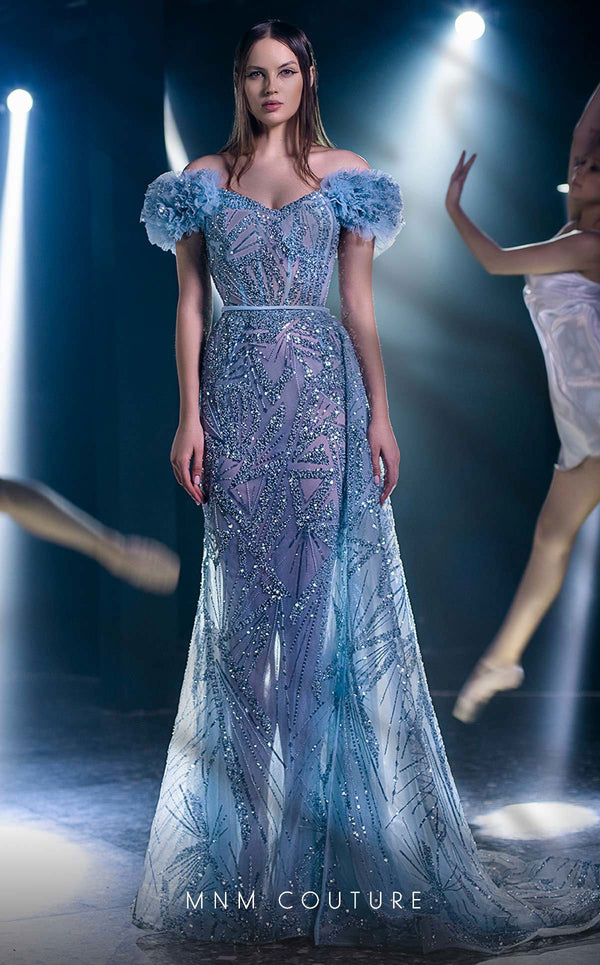 MNM Couture K3963 gown with off-shoulder sleeves, corset-boned bodice, and dramatic cascading ruffles. | Couture Shop LA