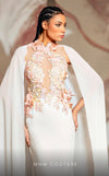 MNM Couture K4145 rayon crepe mesh column dress featuring a halter neckline and elegant train capes. | Couture Shop LA