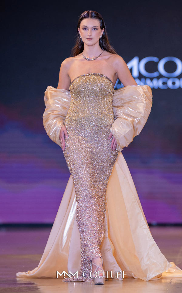 MNM Couture Style M1010 showcasing a sleeveless mermaid gown covered in gradient sequins and beading, with a round neckline and a removable long cape. | Couture Shop LA
