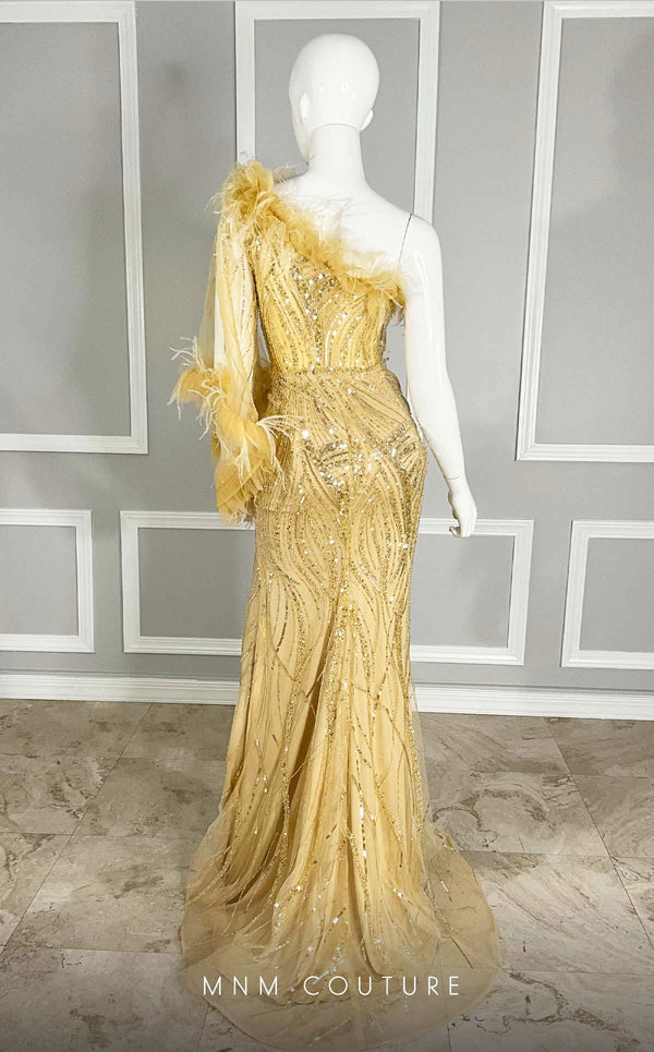 MNM Couture M1073 asymmetric column gown with one long sleeve, sequin and bead embroidery, plumage on the neckline, and a thigh-high slit. | Couture Shop LA