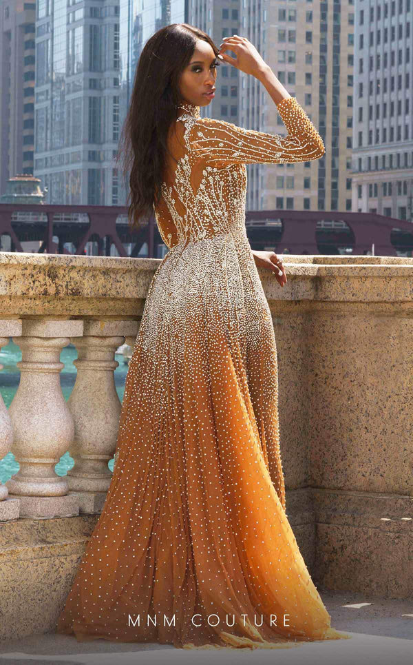 Elevate your evening with the MNM Couture M1127 gown, featuring a lavish design, adorned with sparkling crystals, creating a vision of elegance and luxury. Shop the exclusive piece | Couture Shop LA
