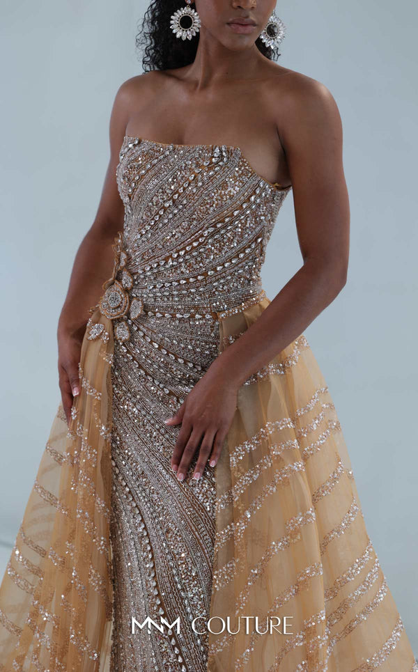 MNM Couture M1186 showcasing a sleeveless, form-fitting mermaid gown fully embellished with sequins, beads, and diamonds, featuring a deep illusion U-neckline. | Couture Shop LA