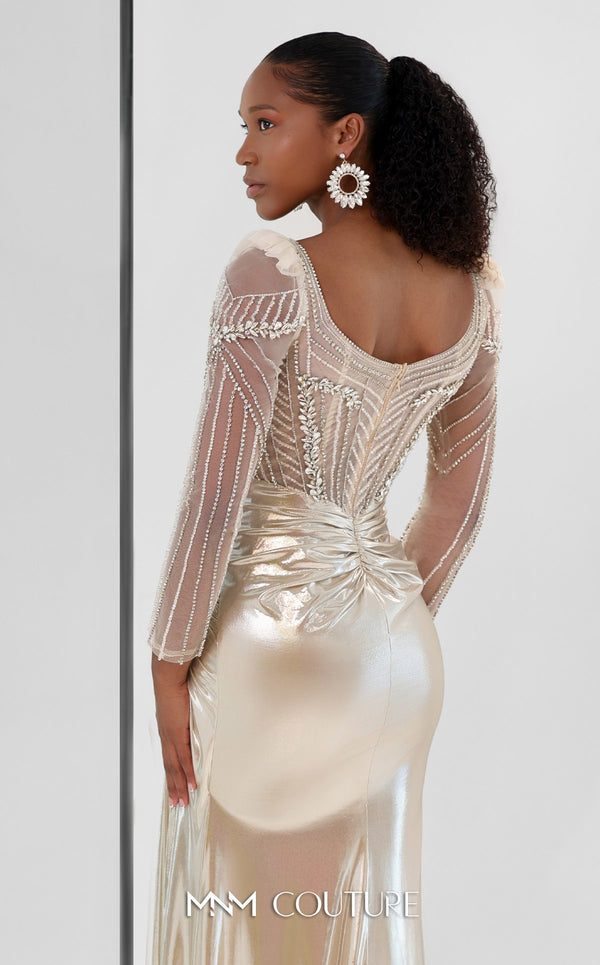 MNM Couture M1312 in gold Lycra satin, showcasing a mermaid silhouette with a beaded illusion bodice, long sheer sleeves, and a draped, gathered waist. | Couture Shop LA