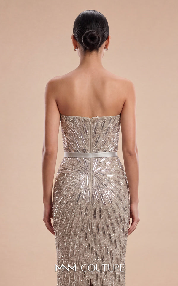 MNM Couture M1319 silver strapless column gown with all-over cascading beaded crystal fringe, sunburst bead pattern from the bust, straight bandeau neckline, satin waistband belt, open back, and center back slit | Couture Shop LA