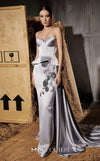 MNM Couture Style N0648 silver silk column dress featuring a sweetheart neckline, peplum corset bodice, floral embroidery with sequins, a fitted skirt, and a dramatic back train for an elegant silhouette | Couture Shop LA