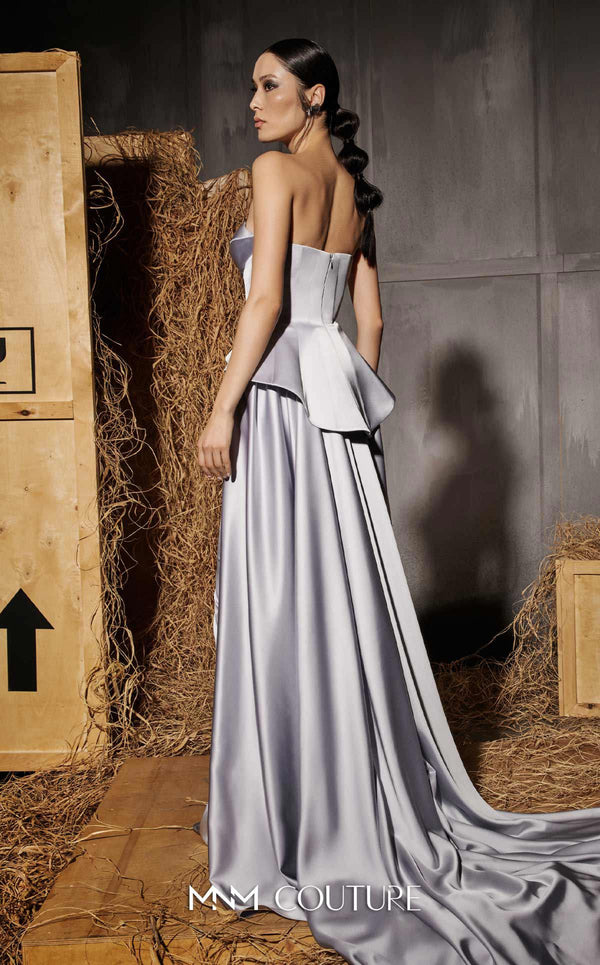 MNM Couture Style N0648 silver silk column dress featuring a sweetheart neckline, peplum corset bodice, floral embroidery with sequins, a fitted skirt, and a dramatic back train for an elegant silhouette | Couture Shop LA
