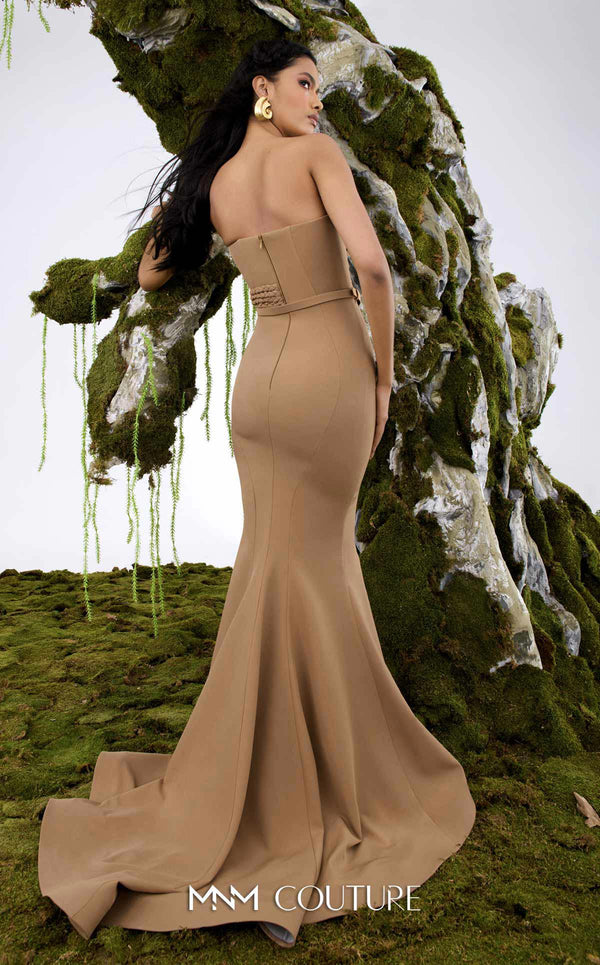 MNM Couture Style N0676 in mocha, showcasing a mermaid silhouette with an asymmetric sweetheart neckline, a half-bow detail on the bust, braided strap accents, and a long train. | Couture Shop LA