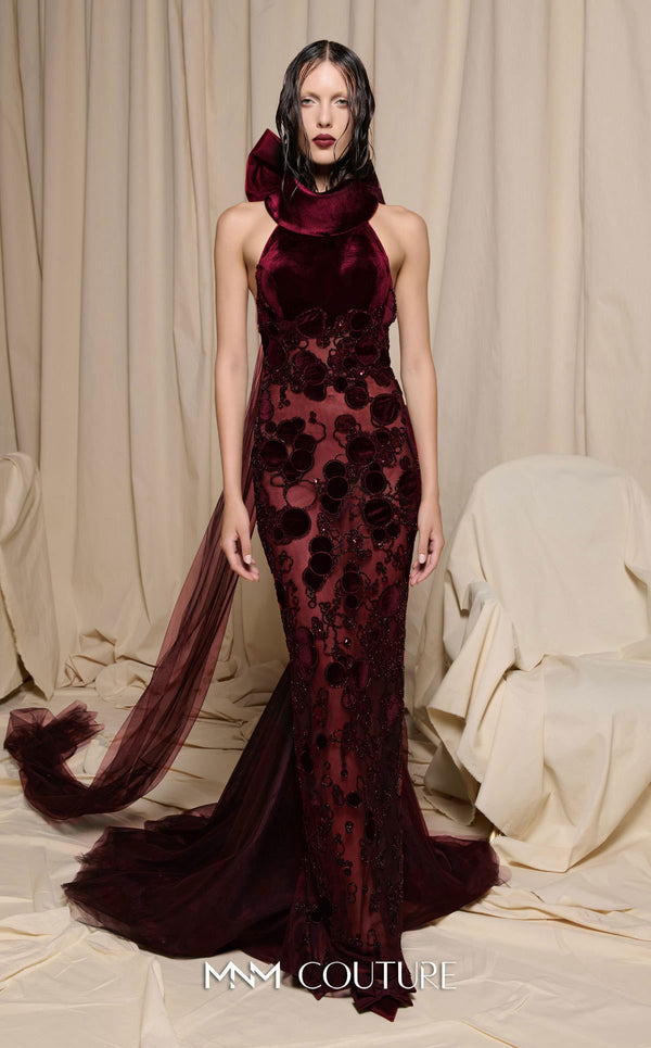 MNM Couture Style N0699 halter gown with velvet appliqués, beading, and a large bow with a long train at the back. | Couture Shop LA