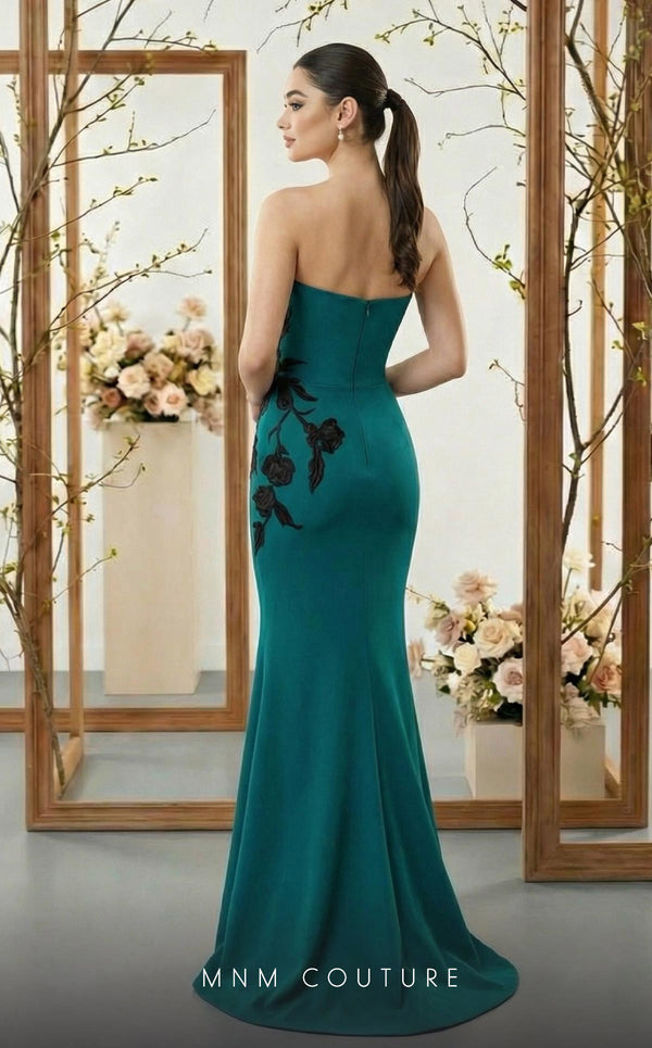 MNM Couture N0700 green and purple crepe column gown with leather floral appliqués, asymmetrical neckline, and trumpet train | Couture Shop LA