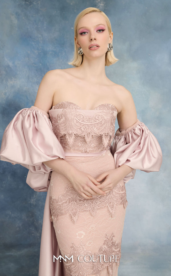 MNM Couture N0731 convertible blush strapless lace column gown with tiered scalloped guipure skirt, floating lace peplum, thin satin belt, and detachable puff-sleeve satin overcoat with pooling train | Couture Shop LA.