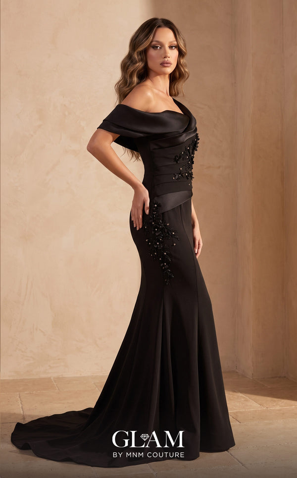 MNM Couture O07835 stretch crepe mermaid gown with high folded satin drape at left shoulder, diagonal neckline, satin cap down right arm, wide satin waistband, asymmetric left hip satin panel, 3D floral appliqués with crystals and pearls, open back, and sweep train | Couture Shop LA