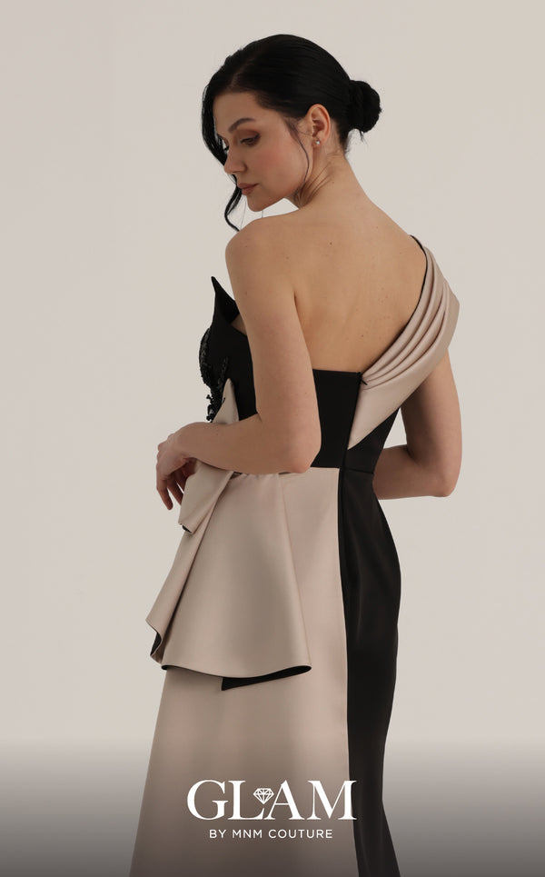 MNM Couture O07853 one-shoulder rayon crepe gown with deep-v mesh neckline, beadwork, and draped side train