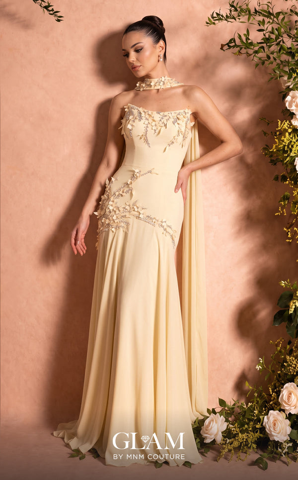 MNM Couture O07864 butter yellow strapless column gown with softly curved bandeau neckline, open back, 3D botanical crystal appliqués, and detachable floral choker with floor-length chiffon écharpe panels | Couture Shop LA