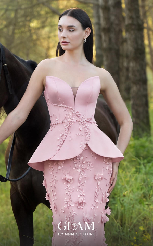 MNM Couture O07909 black strapless gown with illusion sweetheart neckline, crystal beaded waist vine, petal peplum panels, and fitted tulle skirt with 3D floral appliqués | Couture Shop LA