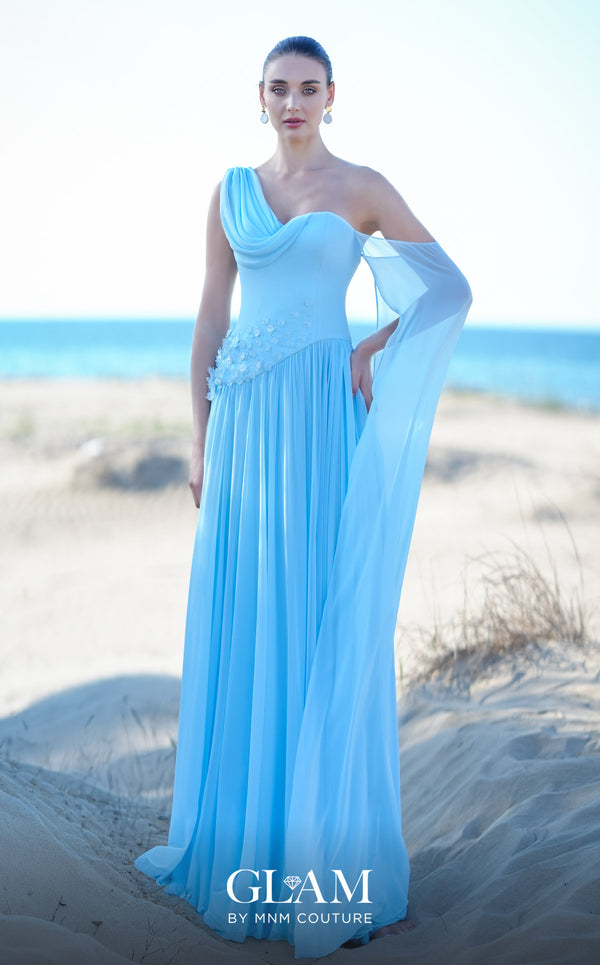 MNM Couture O09003 sky blue one-shoulder Grecian chiffon gown with soft cowl drape, 3D floral cluster at the right hip, densely pleated A-line skirt, and long flowing arm veil | Couture Shop LA