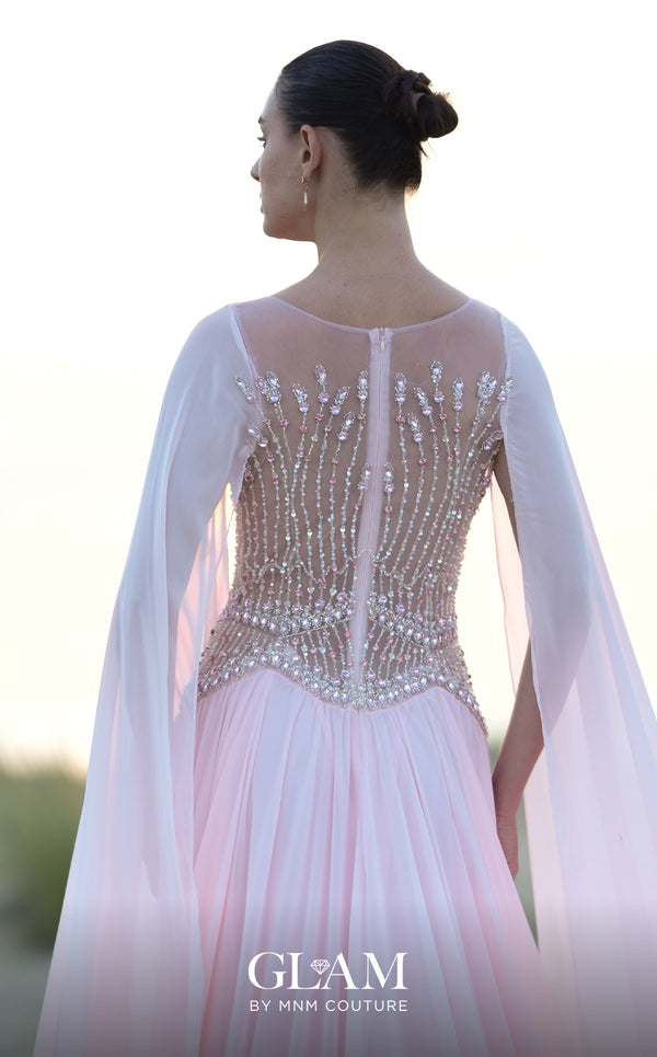 MNM Couture O09004 blush pink A-line gown with fully beaded illusion corset bodice, high bateau neckline, floor-length chiffon cape panels at both shoulders, and full chiffon skirt with sweep train | Couture Shop LA