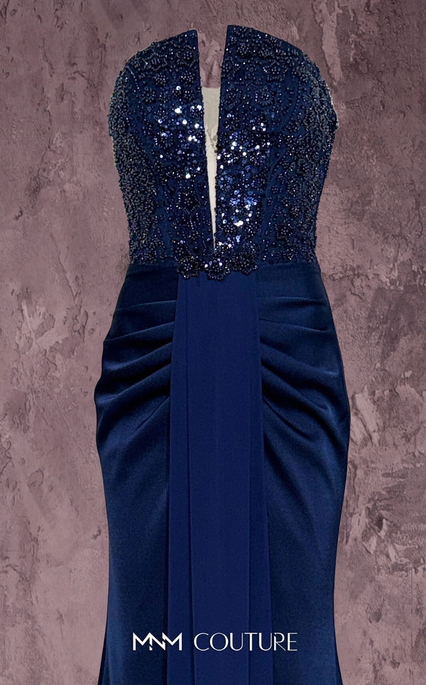 MNM Couture Style Q7545 beaded evening gown with a corseted bodice, ruched hips, and pleated mermaid skirt. \ Couture Shop LA