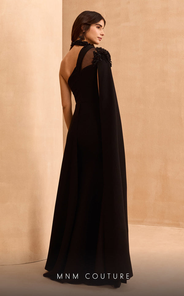 MNM Couture V02037A black rayon crepe dress with cape sleeve, asymmetric neckline, and rhinestones.| Couture Shop LA