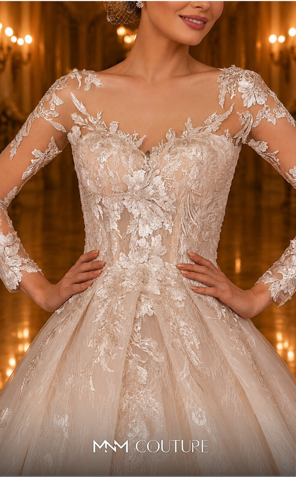 MNM Couture W2106 princess gown with sheer sleeves, lace overlays, and intricate beaded details. | Couture Shop LA