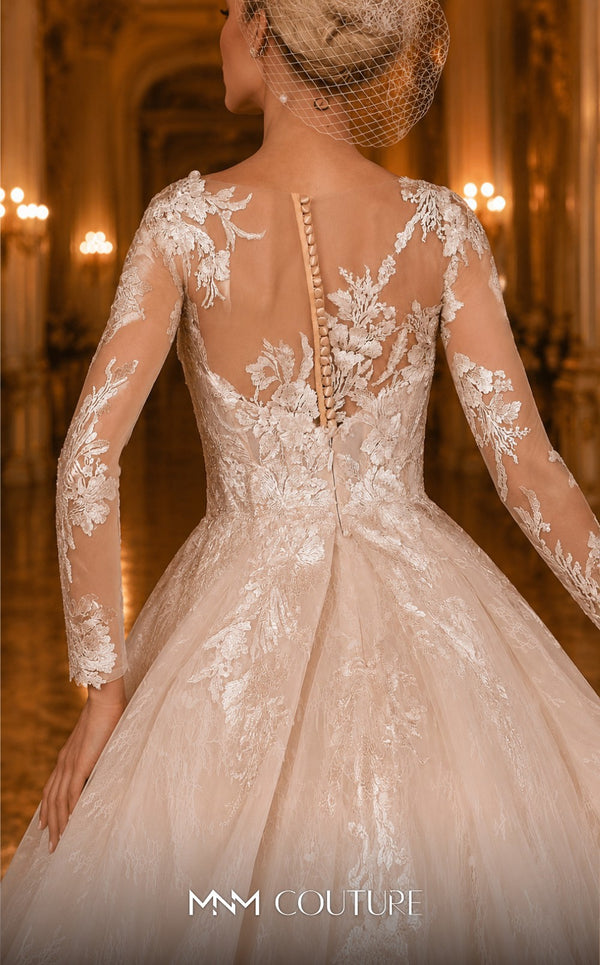 MNM Couture W2106 princess gown with sheer sleeves, lace overlays, and intricate beaded details. | Couture Shop LA