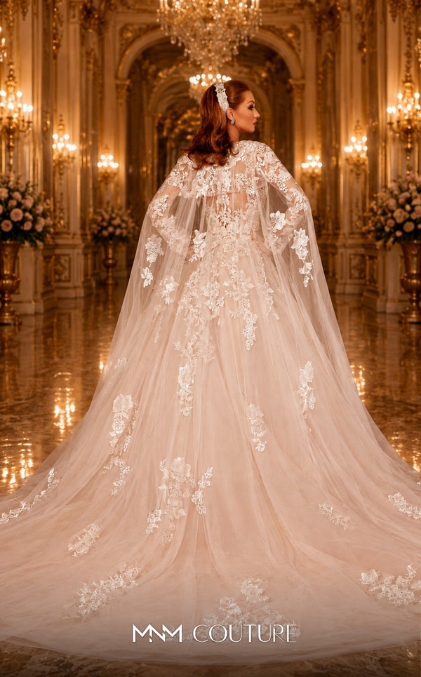 MNM Couture W2108 princess gown with removable tulle cape, lace appliques, and deep V-neckline details. | Couture Shop LA