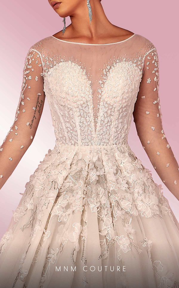 MNM Couture W2116 princess gown with 3D lace flowers, tulle layers, and intricate beaded sleeves. | Couture Shop LA