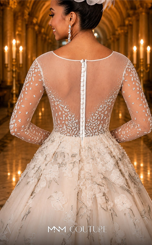 MNM Couture W2116 princess gown with 3D lace flowers, tulle layers, and intricate beaded sleeves. | Couture Shop LA