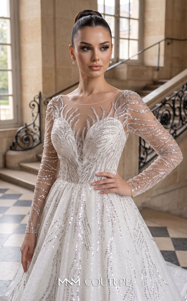 MNM Couture W2308 white illusion ball gown wedding dress with V-scoop neckline, long sheer sleeves, all-over crystal and sequin branch embroidery, deep V open back with corset tie, and cathedral train | Couture Shop LA