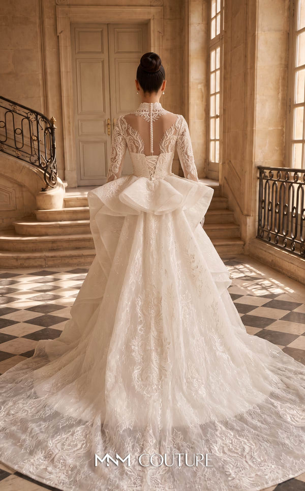 MNM Couture W2315 white 3D lace mermaid wedding dress with illusion stand-up high collar, long lace sleeves, pearl button back with corset tie, and detachable peplum tulle overskirt with cascading drapes and cathedral train | Couture Shop LA