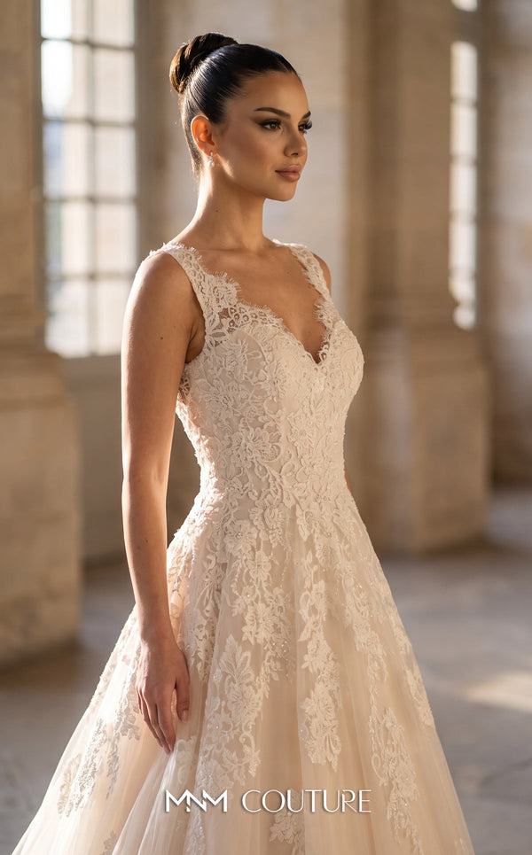 MNM Couture W3580 champagne A-line wedding dress with deep V-neckline, thin spaghetti straps, dramatically deep V open back, scattered 3D floral lace appliqués, and flowing tulle skirt with sweep train | Couture Shop LA