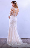 MNM Couture 10090 gown with lace-adorned bodice, sheer sleeves, and a queenly vibe.| Couture Shop LA