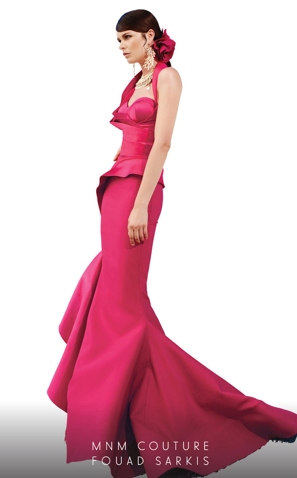 A glamorous sleeveless MNM Couture 2334 gown featuring halter straps, peplum accents, and a dramatic ruffled mermaid skirt with a sweep train, tailored for haute couture elegance. | Couture Shop LA