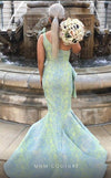 MNM Couture 2425 long mermaid gown with asymmetric neckline and stylized brocade design.| Couture Shop LA